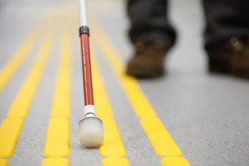 End tip of white can on pavement