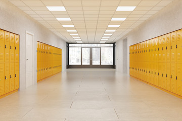 Picture of empty school hallway with yellow lockers. 