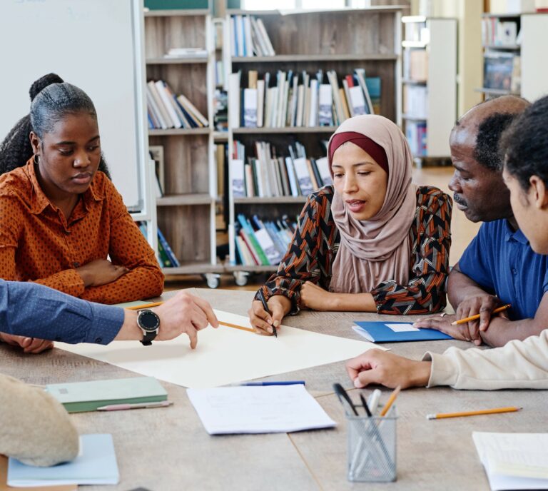 group of educators and community partners working together at a table