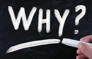 The word WHY on blackboard